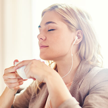 woman relaxing with a cup of coffee